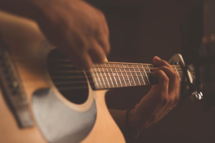 person playing guitar